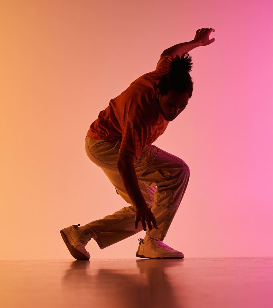 Dancer in coloured stage light